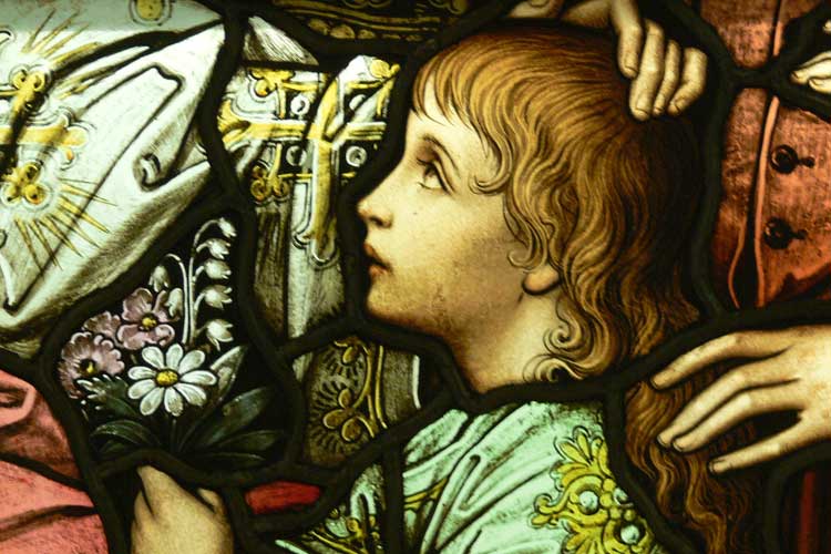 Stained glass window detail of little child